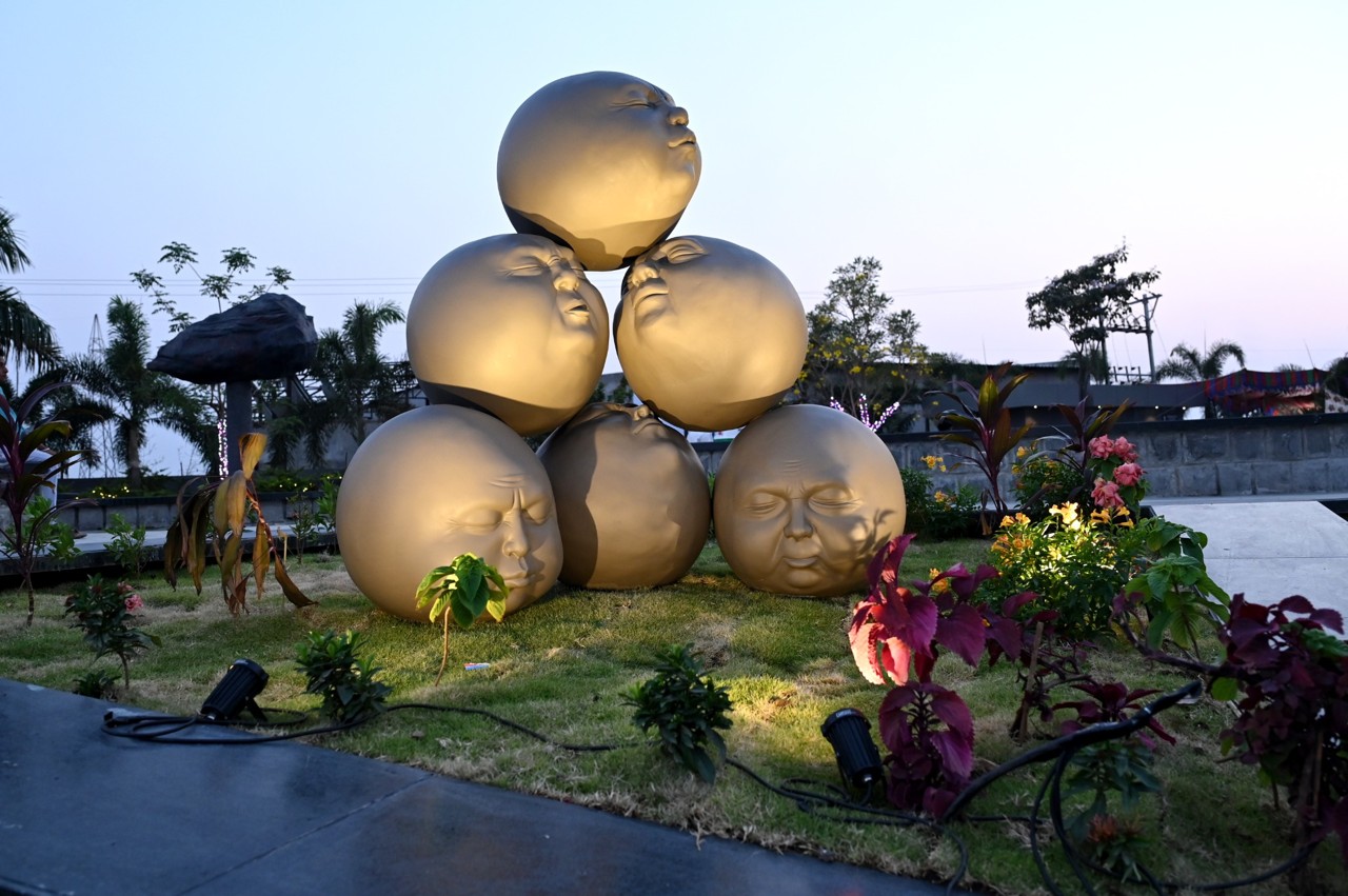 Sculptural garden feature surrounded by plants at The MB Resort
