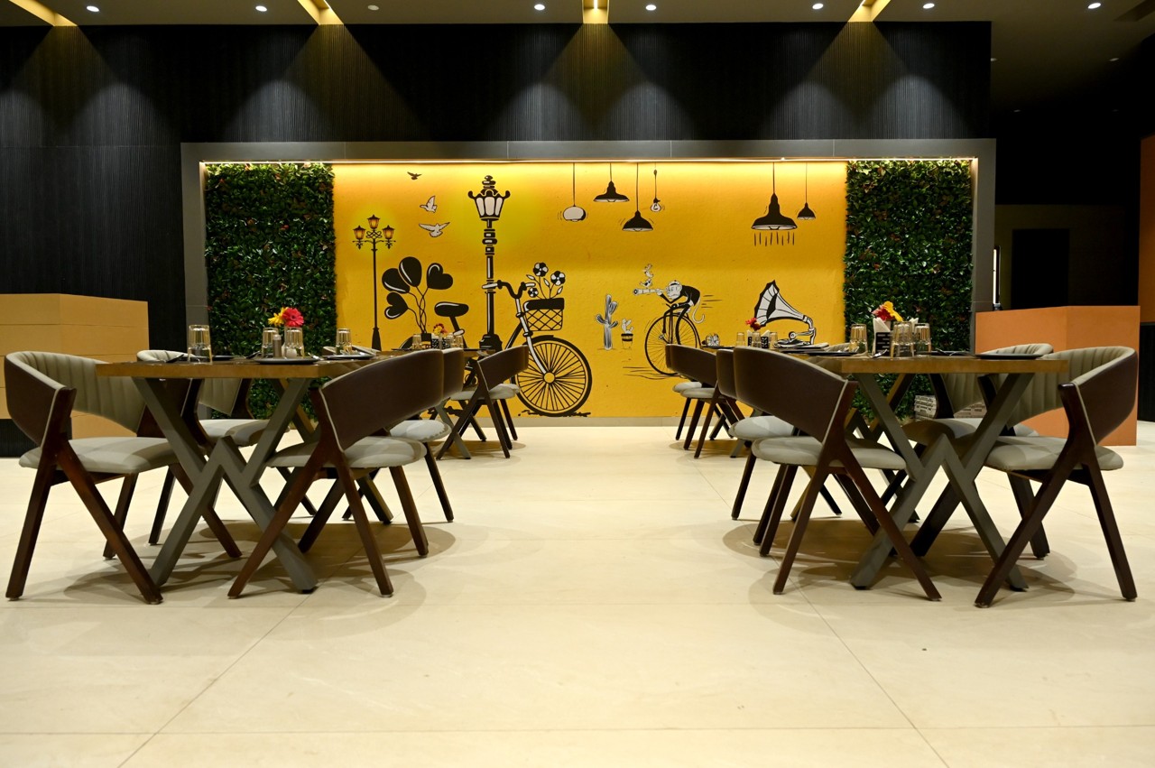 Dining area and wall mural at The MB Resort